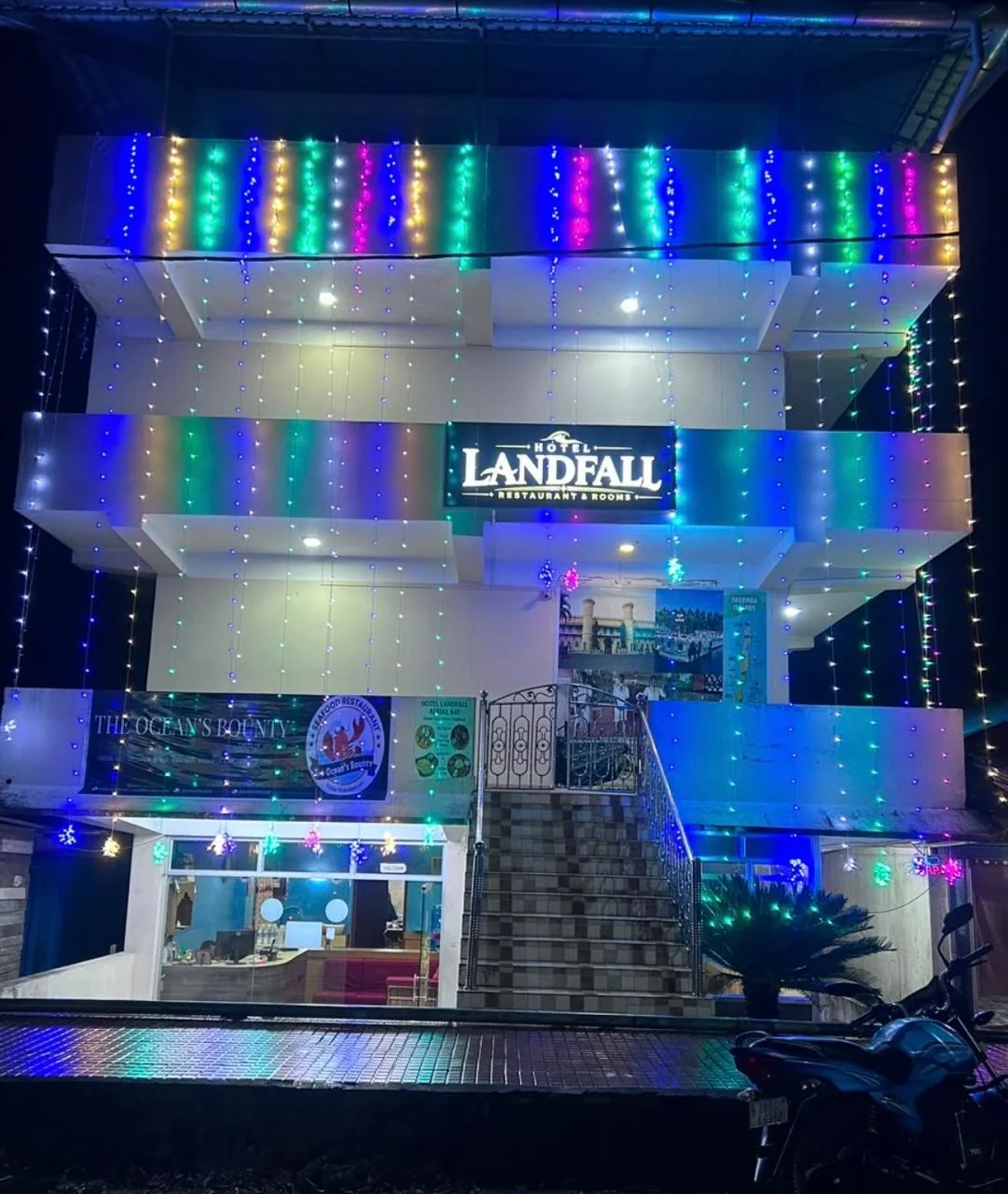 Hotel Landfall exterior illuminated at night